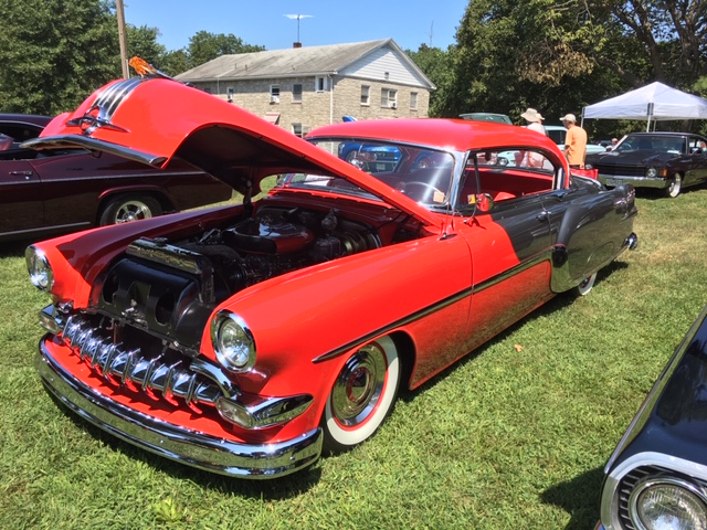 red and silver 1954 Pontiac Star Chief